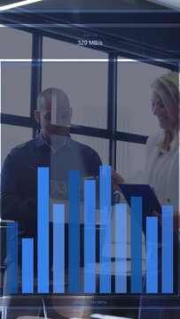 Vertical video: Team tapping tablet and pointing notes, overlay bars rising MB or s for network test