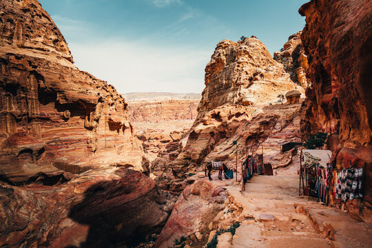 Hiking trail stairs and narrow sandstone passages leading to the Monastery in Petra, Jordan.