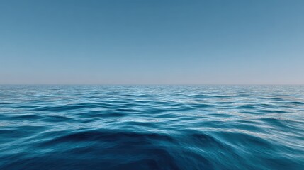Fototapeta premium Tranquil Blue Ocean Surface Under Clear Sky with Gentle Waves and Soft Reflections for Serenity and Peaceful Nature Scenes