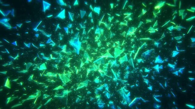 Slow motion tracking shot of glowing polygon shards dispersing in dark abstract digital space with neon blue green light