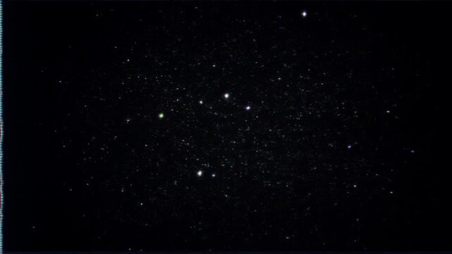 Panning shot of star field slowly drifting across night sky with faint constellations and scattered stars