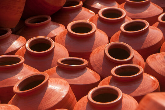 Earthen pot being made using potter's wheel, India