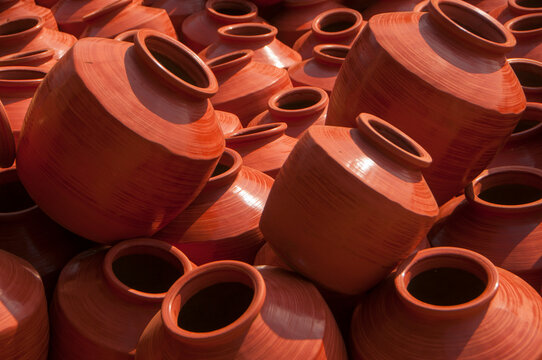 Earthen pot being made using potter's wheel, India