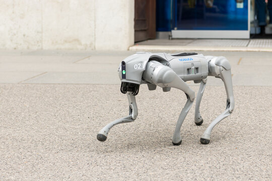 15 March 2026, Vienna (Wieden, TU Wien &ndash; Resselpark), Austria. Close-up of quadruped robot walking on pavement near university entrance