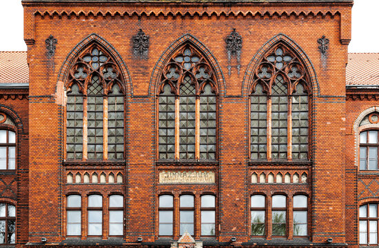 Pointed arch gothic windows of the ancient school building in Grudziądz