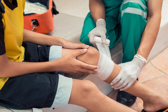 First Aid. Doctor bandages to stop the bleeding first aid for the wounded. Concept first aid and treatment for patients.