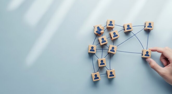 Organizational network structure with connected people icons on wooden blocks, showing team collaboration, stakeholder mapping, social graph, and business communication on a light background
