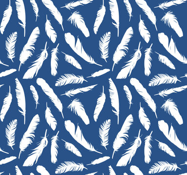 Seamless background with feathers of birds flying.