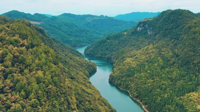 Aerial View of Green Mountains and Clear Rivers in a Scenic Mountain Region