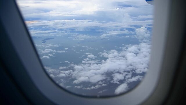 Aerial View of a Spectacular Cloud Sea Seen From an Aircraft Window at Altitude
