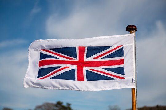 English flag, red cross on white on the Bow of a boat on a lake