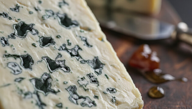Premium Roquefort blue cheese texture with deep blue mold veins macro