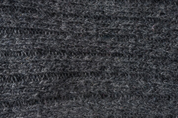 Dark fabric texture background representing textile industry and material detail © yalcinsonat