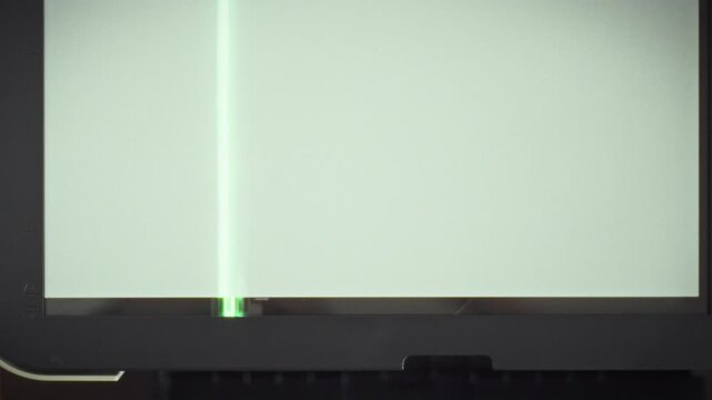 Bright lamp within digital scanner illuminates paper document, transferring its content to electronic media through precise scan process, facilitating digital storage and potential print remanufacture