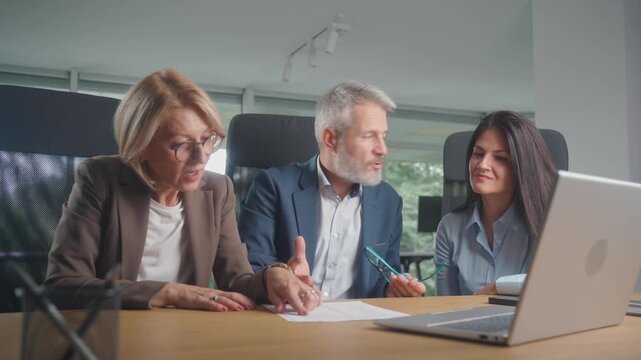 Multiracial business professionals teamwork in office, achieving goals and improving productivity