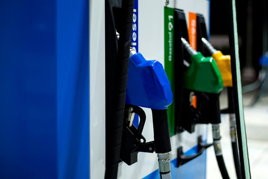 Close-up fuel nozzles on petrol and diesel fuel in gasoline stations.
