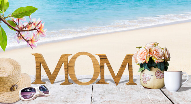 Mother's day card background idea, Mom wooden font with flower vest and coffee cup over tropical beach background