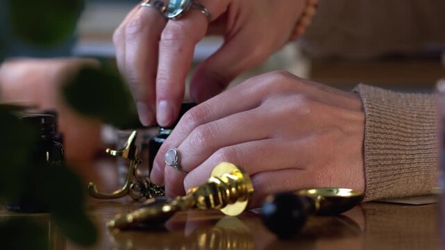 A girl opens a bottle of ink. Wax seal. Sending mail.