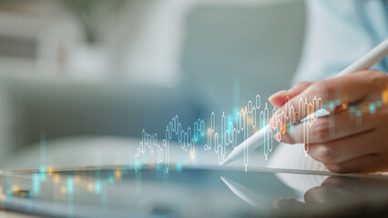 Investment analysis concept with digital chart on tablet showing stock market trends, portfolio performance, and financial data insights, representing strategic investing, risk management.