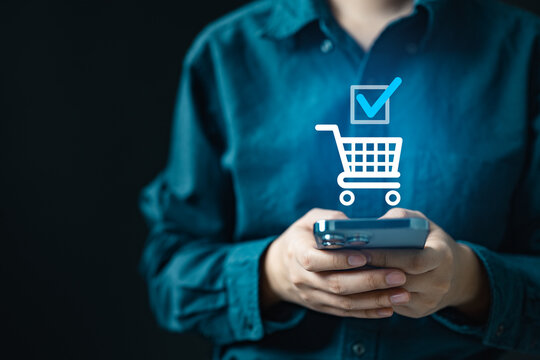 User confirming online order on smartphone with success icon, representing ecommerce checkout, payment approval, and completed digital transaction.