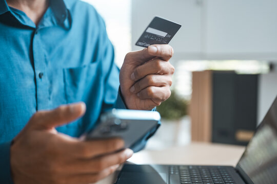 User holding credit card and smartphone for buy now pay later transaction, representing flexible payment, fintech innovation, and online shopping convenience.