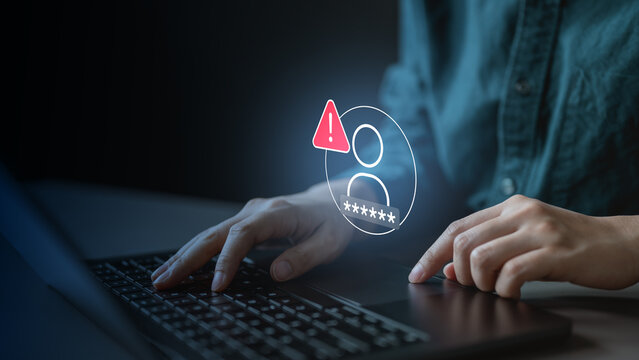 User reviewing login activity on laptop with alert warning, showing suspicious access detection, account security monitoring, and session tracking in cybersecurity system.
