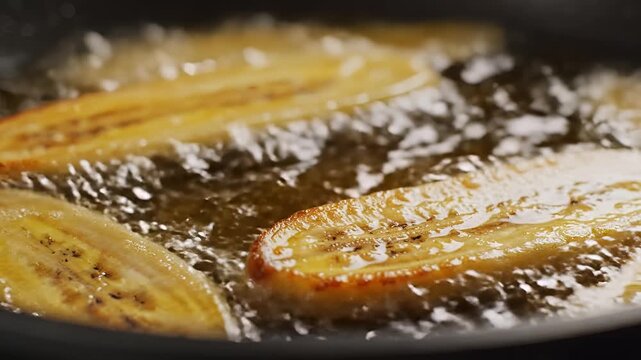 Closeup of Sliced Bananas Frying in Hot Oil.