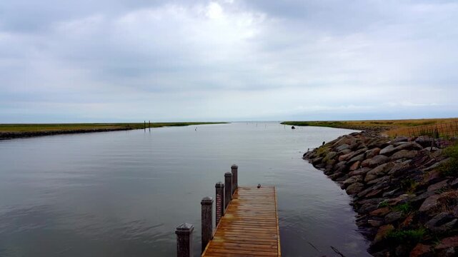 Wooden Jetty and Waterway Leading to Wadden Sea, Ribe, Denmark