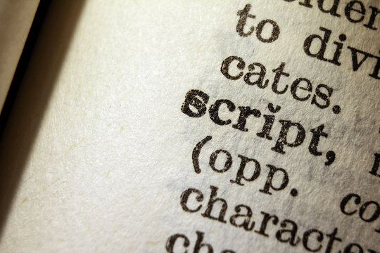 Word script on dictionary page, macro close up