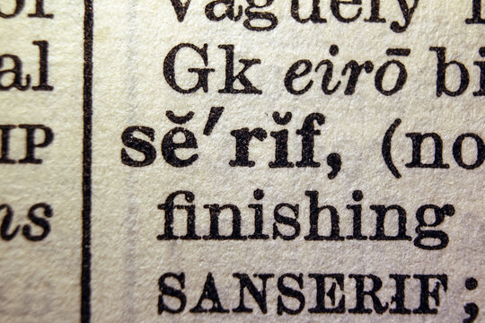 Word serif on dictionary page, macro close up