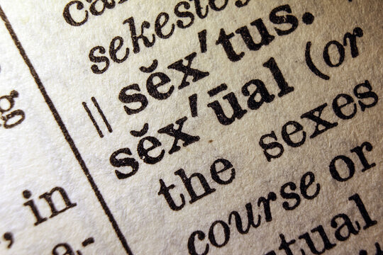 Word sexual on dictionary page, macro close up