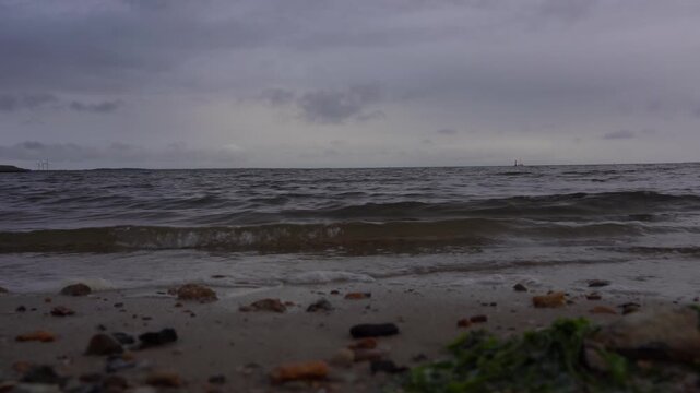 Extreme Low Angle View of North Sea Waves on Pebble Beach Near Esbjerg, Denmark