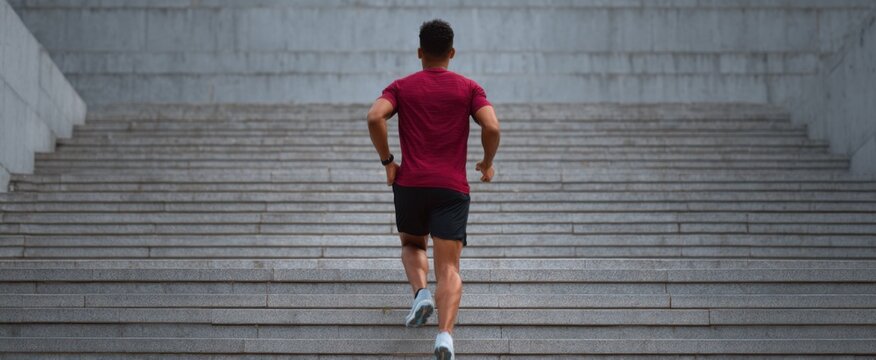 The individual races up concrete stairs like a gazelle bounding toward fitness glory