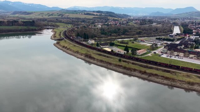 Aerial view of Besenova balancing reservoir in Liptov with turquoise water and spring landscape in Slovakia