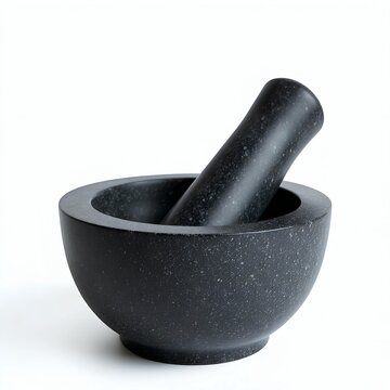 Black sone mortar and pestle used for grinding herbs and spices
