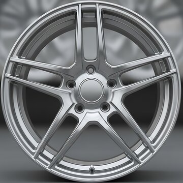 Close-up of a silver alloy wheel.
