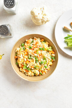 Cauliflower fried rice with carrot, green pea, corn, scrambled eggs