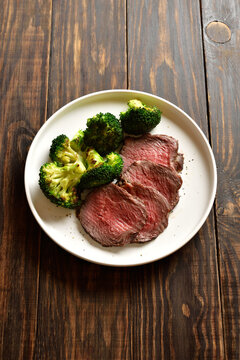 Beef steak served with roasted broccoli