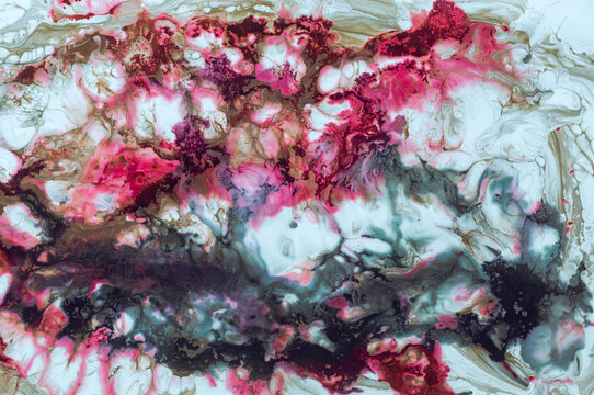 Colorful abstract design created with fluid art techniques on canvas surface