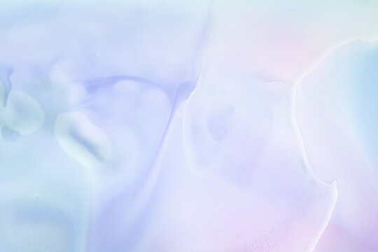 Soft blending of pastel colors creates an abstract pattern on a smooth surface during daylight hours