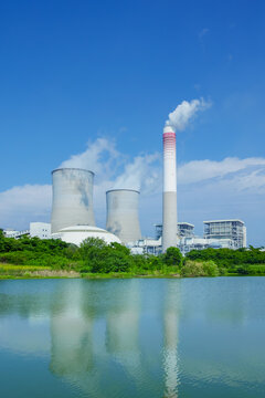 Modern Coal-Fired Power Plant with Cooling Towers by the Water