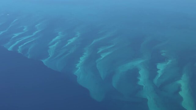 close up -  4k aerial video footage - flying across turquoise water surface and a small atolls in territory of The Bahamas, located in the Caribbean Sea in Atlantic Ocean