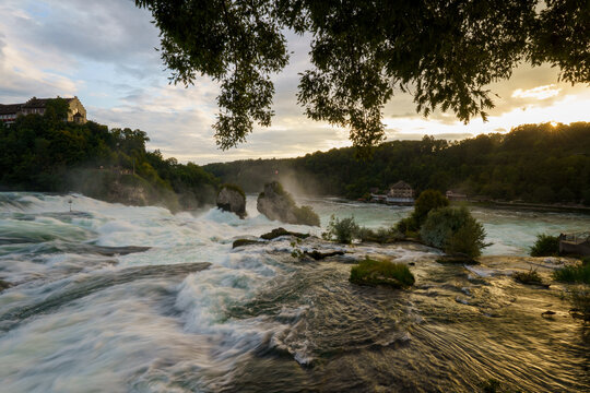 Majestic sunset over Rhine Falls (Rheinfall) and Laufen Castle (Schloss Laufen), Switzerland