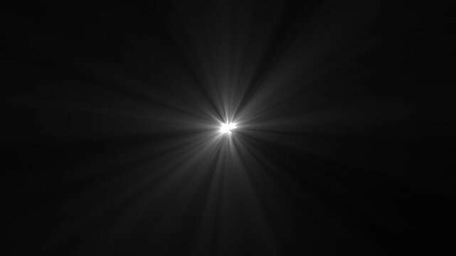 Bright white optical lens flare glowing in the center of a dark black background with sharp light rays radiating outward in a cinematic motion style background.
