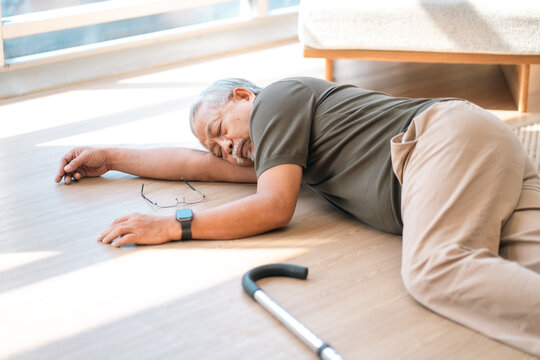 Accidents and health insurance concept, elderly man lying floor unconscious senior home fallen person emergency medical aid indoor accident senior health crisis retirement age home safety worried