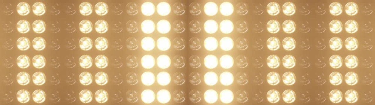 Widescreen flashing lights with bright warm lamps pulsing in patterns, perfect for music videos, club events, and show intros, concert visuals and dynamic stage backgrounds	
