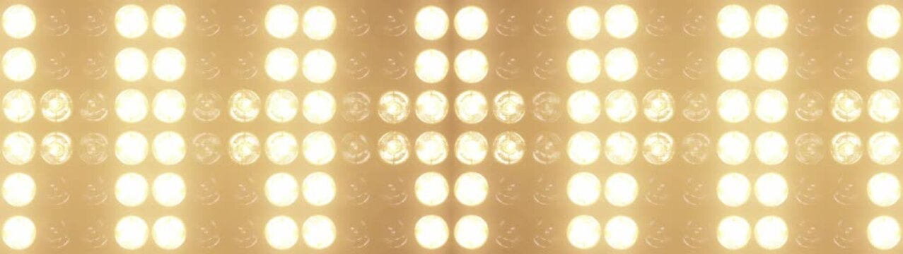 Widescreen flashing lights with bright warm lamps pulsing in patterns, perfect for music videos, club events, and show intros, concert visuals and dynamic stage backgrounds	
