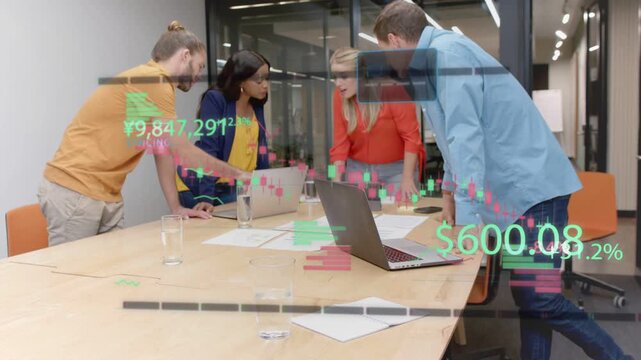 Team leaning over table, pointing to laptop and showing animated finance charts, reaching consensus
