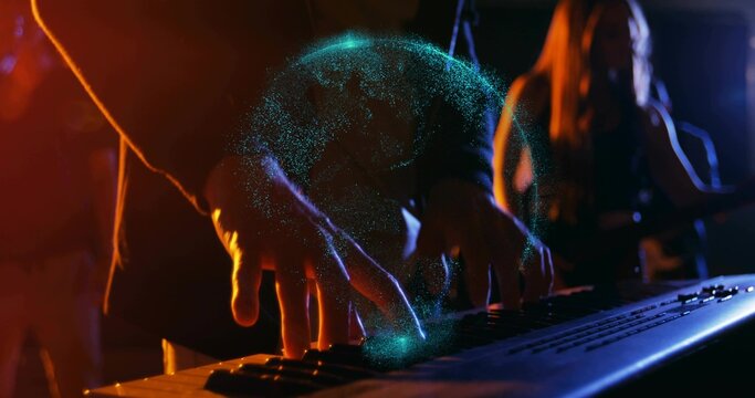 Playing keyboardist's hands wearing dark outfit gliding over keys on stage, creating teal hologram
