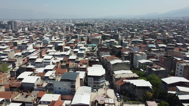 Aerial View of Dense Urban Neighborhood with Irregular Housing Development, Crowded Residential Buildings and Unplanned Overpopulation City Expansion